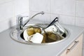 Many dirty dishes in the kitchen sink Royalty Free Stock Photo