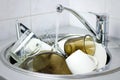 Many dirty dishes in the kitchen sink Royalty Free Stock Photo