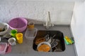 Many dirty dishes in the kitchen sink, in the middle Royalty Free Stock Photo