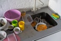 Many dirty dishes in the kitchen sink, in the middle Royalty Free Stock Photo