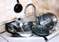 Many of dirty dishes in the sink in kitchen Royalty Free Stock Photo