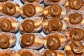 Many donuts placed in a tray, for sale at food market