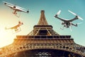 Many drones with digital camera flying around Tour Eiffel