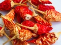 Many Dry Birds Eye Chilis on a White Plate