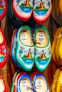 Many dutch traditional wooden shoes or clogs for sale in souvenir shop in Holland Royalty Free Stock Photo