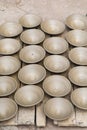 Many earthen pots or clay pots are kept for drying in the sun in the workshop