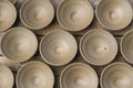 Many earthen pots or clay pots are kept for drying in the sun in the workshop