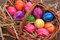 Many Easter eggs in a brown basket