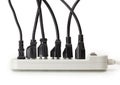 Many electrical cords connected to a power strip