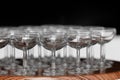 Many elegant empty glasses of wine or champagne on the wooden table in wedding day. Set of blank empty glasses displayed Royalty Free Stock Photo