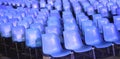 empty blue plastic chairs without people before the start of a live concert Royalty Free Stock Photo