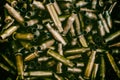 Many empty bullet shells, pile of used rifle cartridges 7.62 mm caliber, assault rifle bullet shell, military background, top view Royalty Free Stock Photo