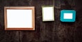 Many empty colorful picture frame mock up on black wall with copy space for add or fill text