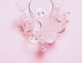 Many empty glasses on pink background. Top view, flat lay Royalty Free Stock Photo