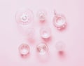 Many empty glasses on pink background. Top view, flat lay Royalty Free Stock Photo