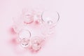 Many empty glasses on pink background. Top view, flat lay Royalty Free Stock Photo