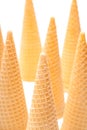Many empty ice cream cones twisted on a white background