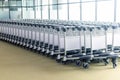 Many empty luggage trolleys at the airport Royalty Free Stock Photo