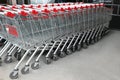 Many empty metal shopping carts near supermarket outdoors Royalty Free Stock Photo