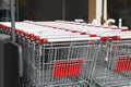 Many empty metal shopping carts near supermarket outdoors Royalty Free Stock Photo