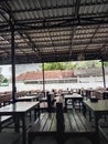 Many empty seats in a simple coffee cafe in the middle of town