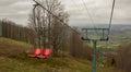 Many empty ski lift chairs in a row close up in the summer Royalty Free Stock Photo