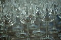 Many empty turquoise transparent green wine glasses on the table in the restaurant Royalty Free Stock Photo