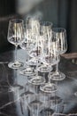 many empty wine glasses on table, vertical photo Royalty Free Stock Photo