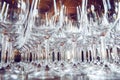 Many empty wine stemmed glasses placed in line on table, close up. Royalty Free Stock Photo