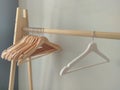 Many empty wooden clothes hangers on the rack Store concept, sale, design, empty hangers. Royalty Free Stock Photo