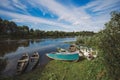 Many empty wooden old boats standing at river bank Royalty Free Stock Photo