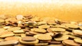 Many Euro coins on a glitter gold background