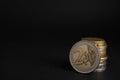 Many Euro coins stacked on black background, closeup. Space for text Royalty Free Stock Photo