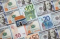 Many euro and dollar banknotes and toy house Royalty Free Stock Photo