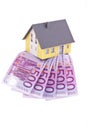 Many euro notes and a house- Royalty Free Stock Photo
