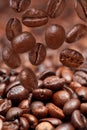 Many falling beans and dark roasted coffee Royalty Free Stock Photo