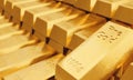 Many fine gold bars with blurred background