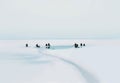 Many fishermen sit on the ice and fishing in winter cold Royalty Free Stock Photo