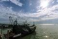 Many fishing boats are floating in the sea near the shore Royalty Free Stock Photo