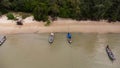 Many fishing boats near the seashore in tropical islands. Pier of the villagers on the southern island of Thailand. top view from Royalty Free Stock Photo