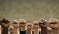 Many fists of multi-ethnic people raised upwards. Royalty Free Stock Photo