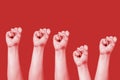 many fists on red background Royalty Free Stock Photo
