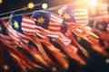 Many flags of different countries flying in the air. 3D rendering, A garland of Malaysia national flags on an abstract blurred Royalty Free Stock Photo