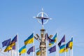 Many flags of Ukraine and the European Union flutter against a clear sky. Emblem of NATO, the concept of the European Union. Royalty Free Stock Photo