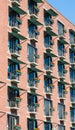 Many Flower Boxes on Brick Building Balconies