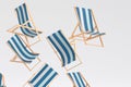 Many of flying striped beach chairs for summer getaways isolated on white Royalty Free Stock Photo