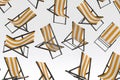 Many of flying striped beach chairs for summer getaways isolated on white Royalty Free Stock Photo