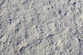 Many footprints in the snow on the pavement Royalty Free Stock Photo