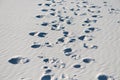 Many of footprints at white sand in desert Royalty Free Stock Photo