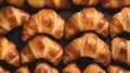 Many fresh croissants in a row. Morning breakfast still life. Coffee cup croissant with cream restaurant cafe. Close up Royalty Free Stock Photo